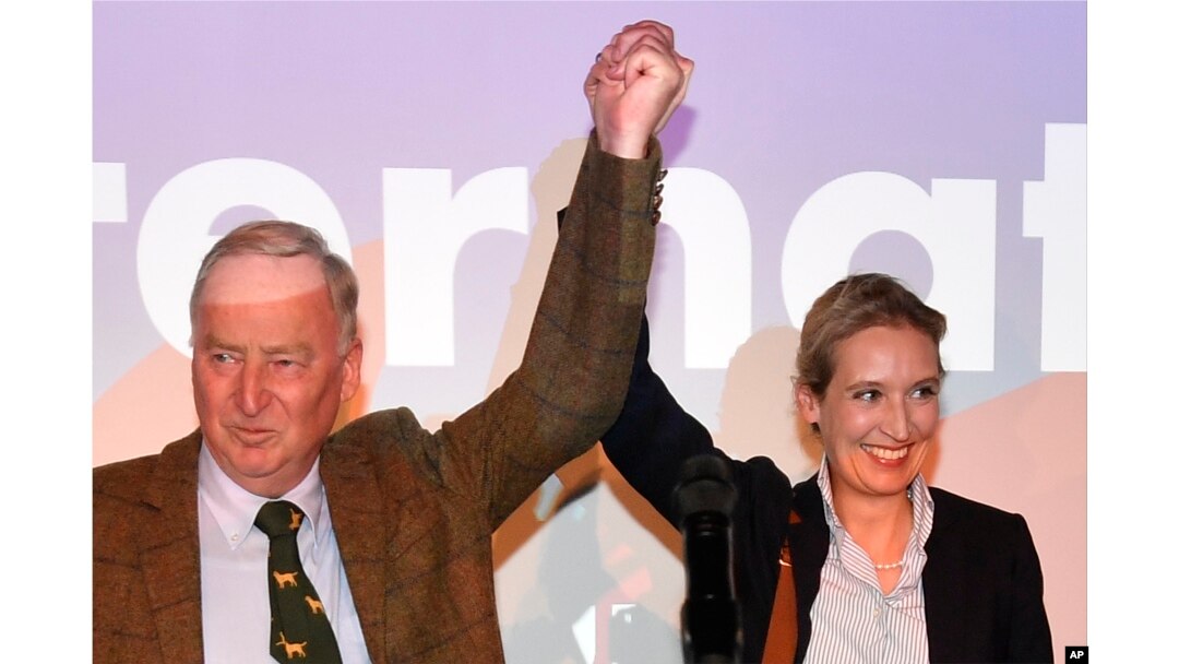 FILE - AfD top candidates Alexander Gauland, left, and Alice Weidel celebrate with their supporters during the election party of the nationalist Alternative for Germany in Berlin, Sept. 24, 2017.
