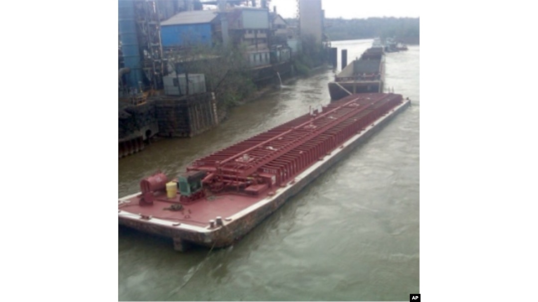 This is one of four massive barges that broke away from their towboat on the Ohio River last April. One sank.
