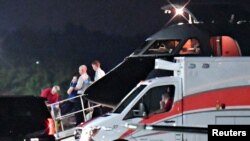Passenger transferred to medical transport airplane to an awaiting ambulance.