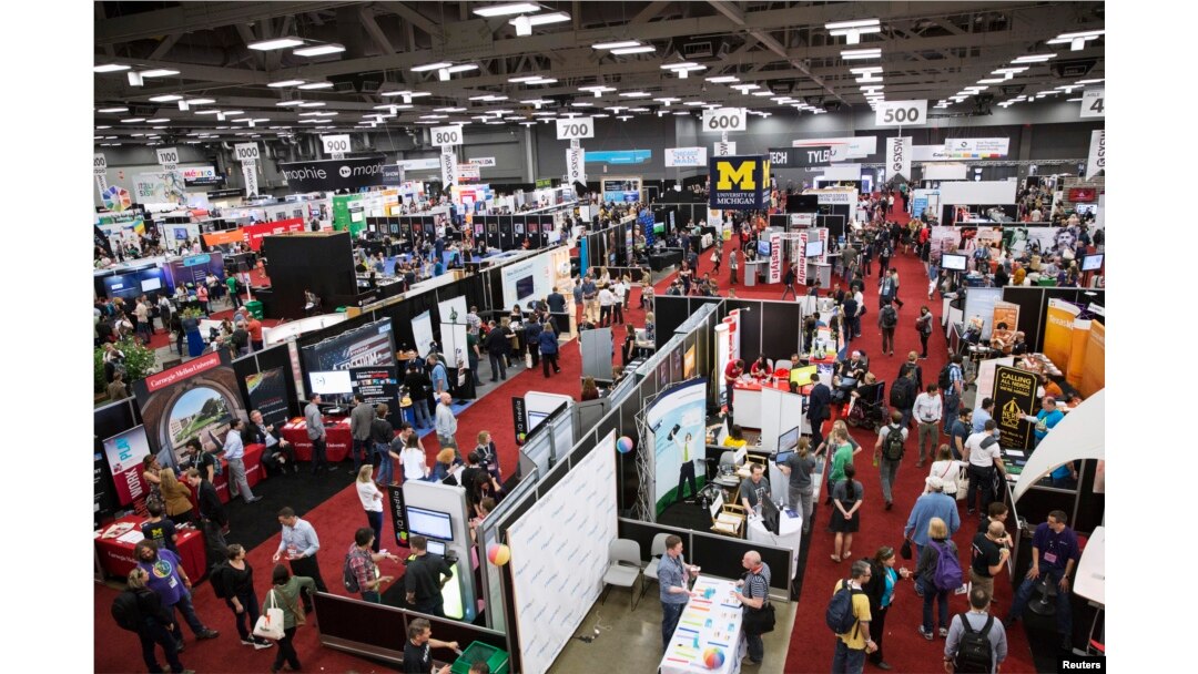 Visitors attend the 2015 Trade Show at the South by Southwest (SXSW) interactive, film and music conference in Austin, Texas, March 15, 2015.