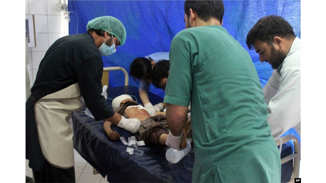 An injured boy receives treatment at a hospital after a clash between Taliban and security forces in Kunduz province, Afghanistan, April 13, 2019.