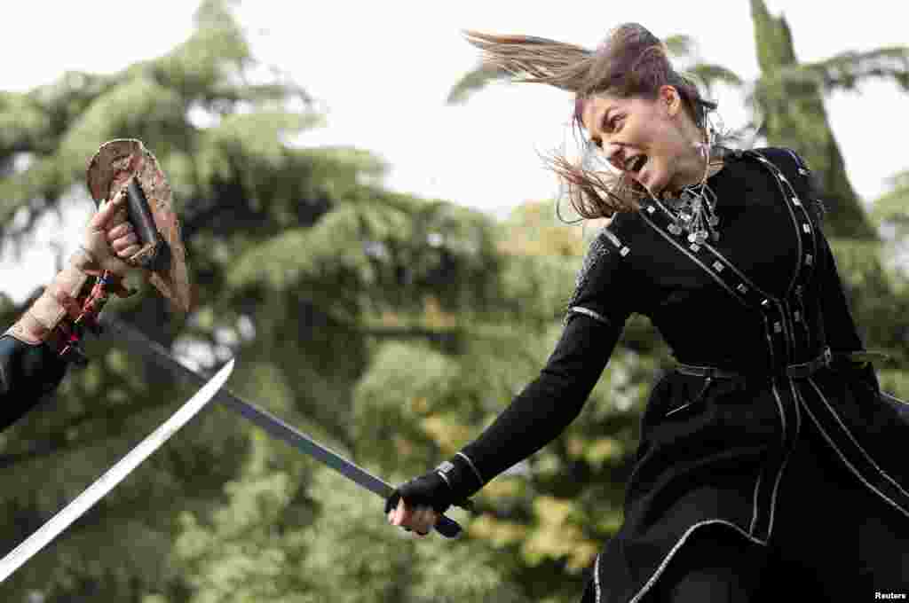 Youth perform Georgian martial arts during the annual Tbilisoba festival, celebrating the City Day in Tbilisi, Georgia.