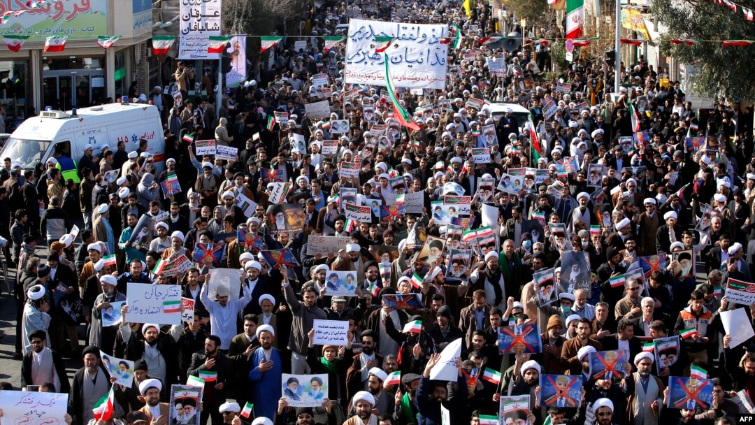 Pro-government demonstrators march in Iran's holy city of Qom, some 130 kilometres south of Tehran, on Jan. 3, 2018, as tens of thousands gathered across Iran in a massive show of strength for the Islamic rulers after days of deadly unrest.