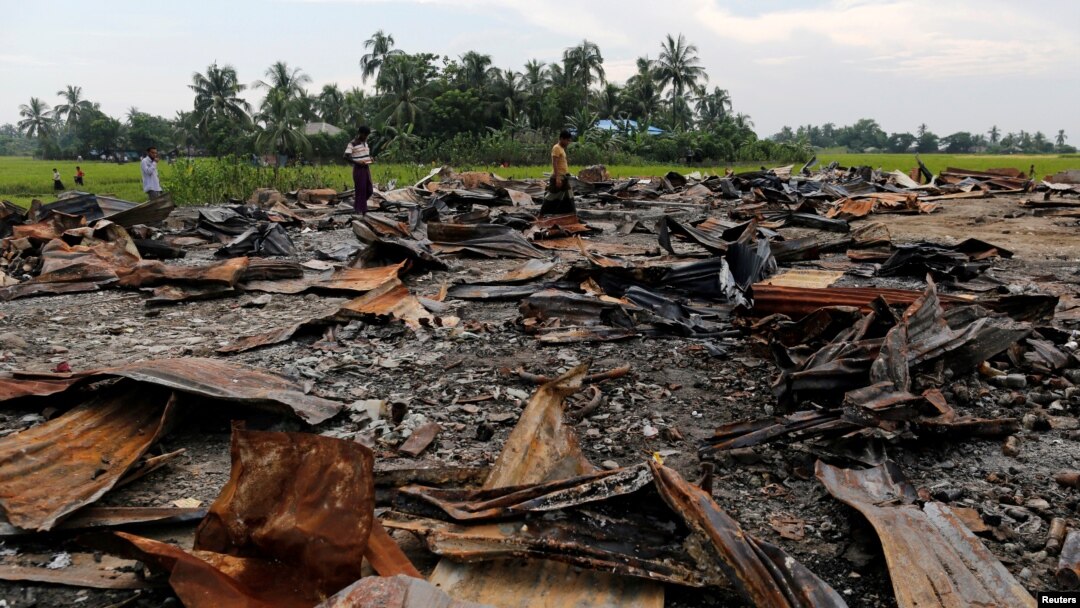 FILE - The ruins of a market that was set on fire are seen at a Rohingya village outside Maugndaw in Rakhine state, Myanmar, Oct. 27, 2016. 