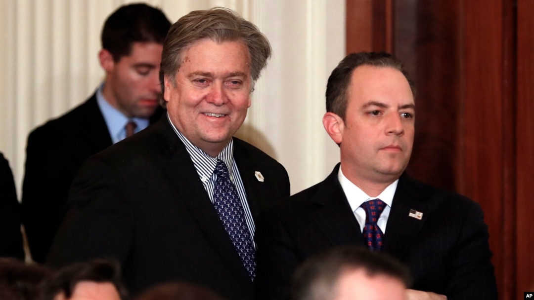 FILE - Steve Bannon, chief White House strategist to President Donald Trump, left, and then-White House Chief of Staff Reince Priebus stand in the East Room of the White House in Washington, Jan. 31, 2017.