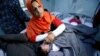 A mother reacts as her daughter Ranmea is treated for possible exposure to chemical weapons agents in a hospital west of Erbil in Mosul, Iraq, March 4, 2017.
