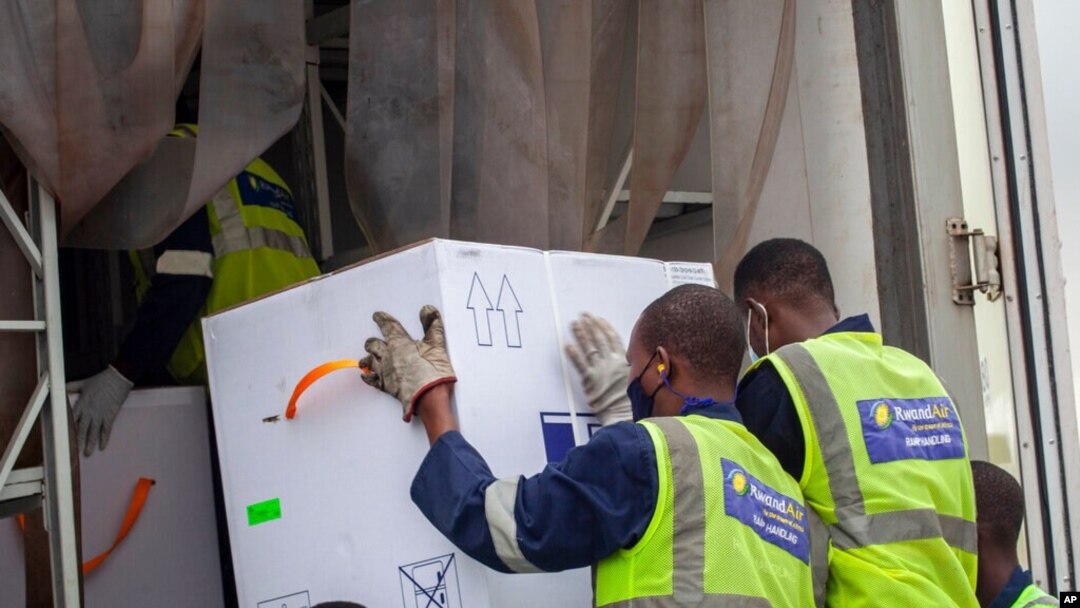 AstraZeneca COVID-19 vaccine doses are received by airport workers in Kigali, Rwanda, March 3, 2021. 