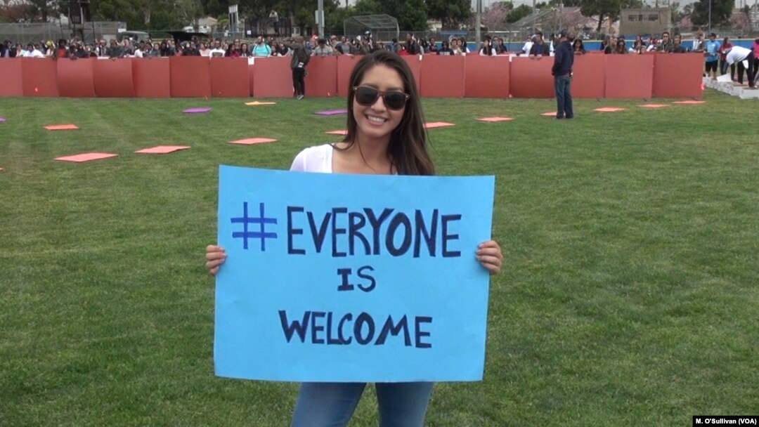  Volunteer at LAX Everyone is Welcome rally.