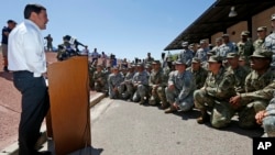 Arizona Republican Gov. Doug Ducey speaks to Arizona National Guard soldiers prior to deployment to the Mexico border at the Papago Park Military Reservation in Phoenix, April 9, 2018.