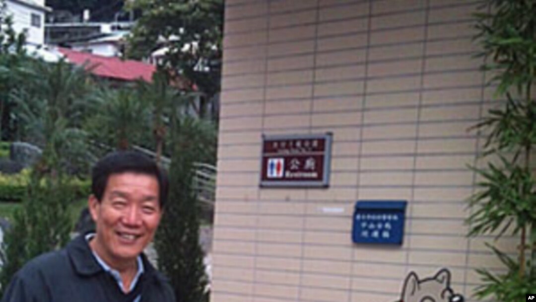 Chientan borough chief Bi Wu-liang shows an outdoor dog toilet as part of an eco-friendly park in his part of Taipei.