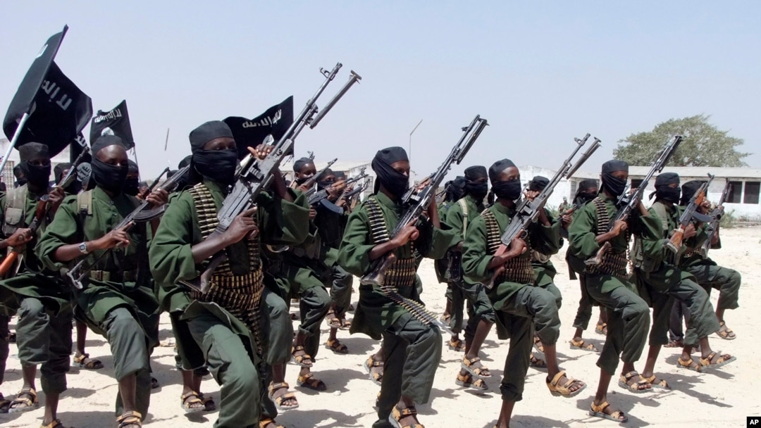 FILE - Hundreds of newly trained al-Shabab fighters perform military exercises in the Lafofe area some 18 km south of Mogadishu, Feb. 17, 2011. 