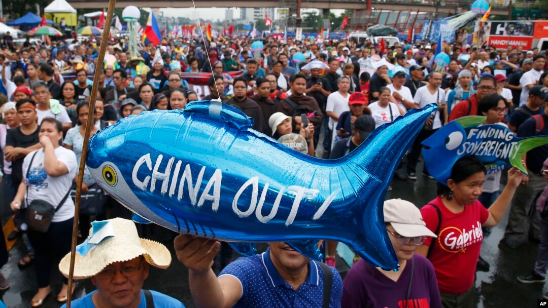 Protesters display a balloon with an anti-China message during a rally near the Philippine Congress to protest the 4th State of the Nation (SONA) address by President Rodrigo Duterte Monday, July 22, 2019 in suburban Quezon city, northeast of Manila.