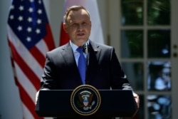Polish President Andrzej Duda speaks during a news conference with President Donald Trump in the Rose Garden of the White House, Wednesday, June 12, 2019, in Washington. (AP Photo/Evan Vucci)