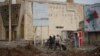 As people pick up the pieces of their city and their lives in eastern Mosul, they say family and friends in the west are even more devastated and still under IS rule. Mosul, Iraq, Jan. 23, 2017. (H. Murdock/VOA)