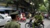 Policemen on motorcycle in Hanoi, Vietnam, June 11, 2010