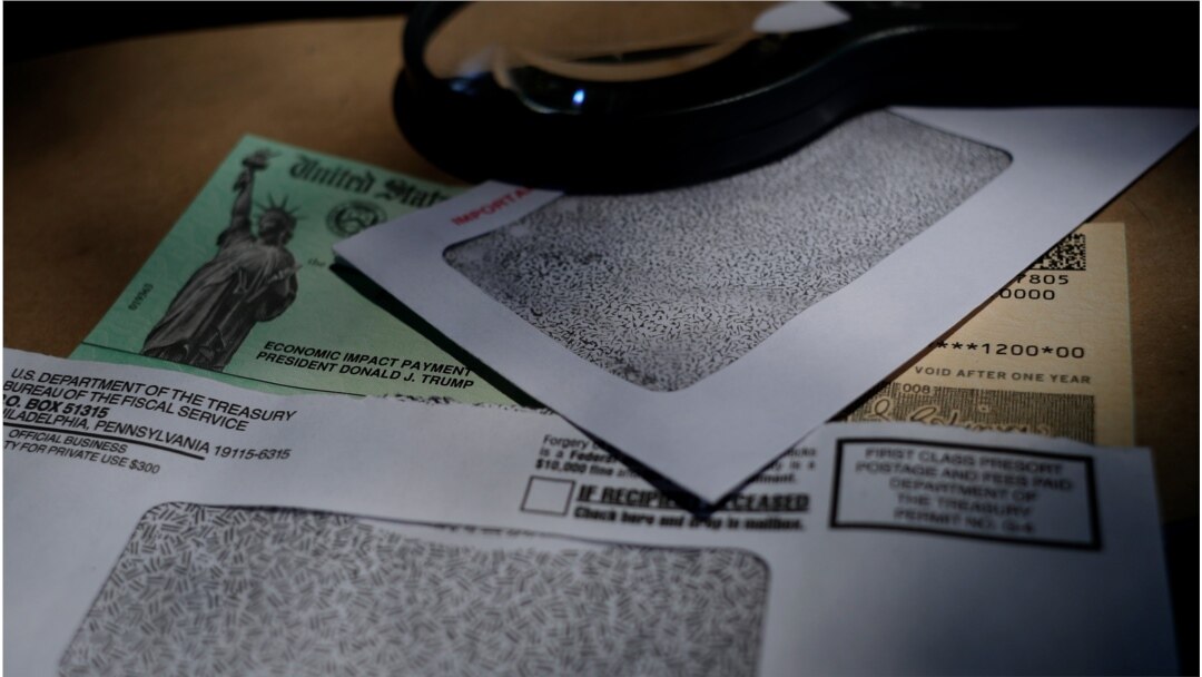 FILE - A stimulus check issued by the Internal Revenue Service to help combat the adverse economic effects of the coronavirus pandemic is seen in San Antonio, Texas, April 23, 2020.