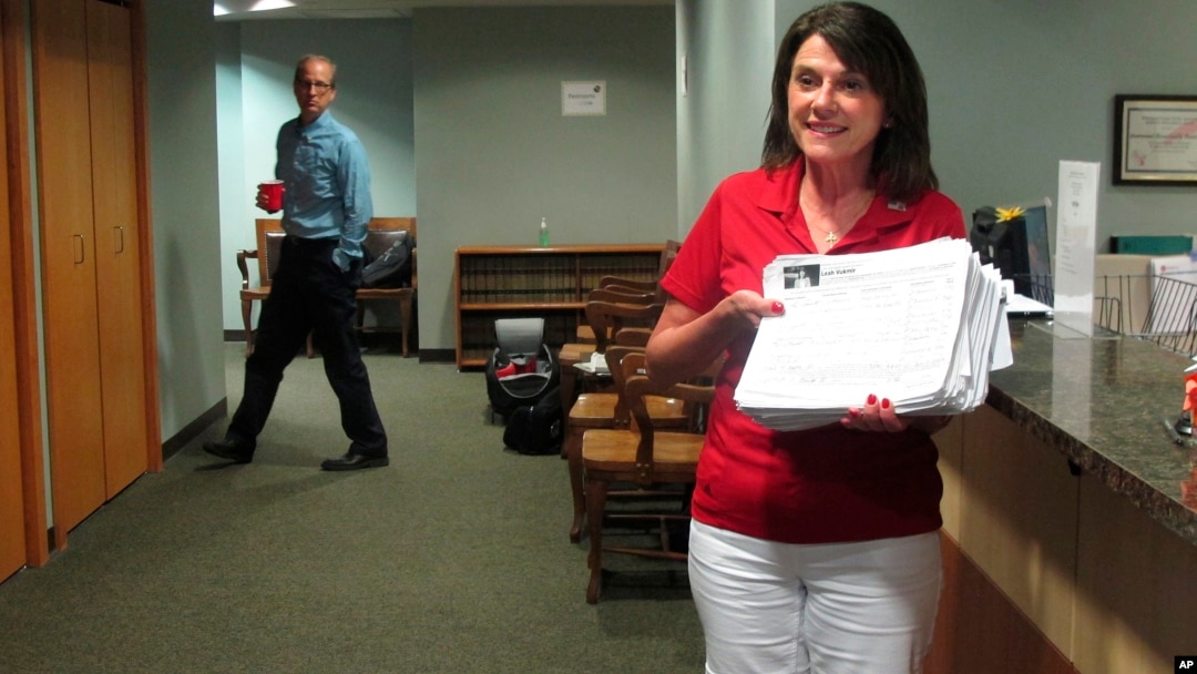 Republican U.S. Senate candidate Leah Vukmir submits nomination papers with Wisconsin elections officials in Madison, Wis., on Wednesday, May 30, 2018. 