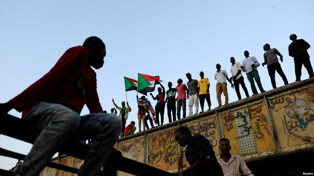FILE - Sudanese protesters rally in front of army headquarters in Khartoum, Sudan, May 6, 2019.