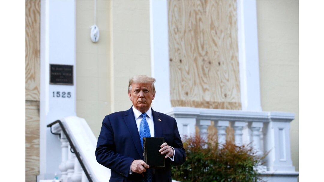 FILE - Then-President Donald Trump holds a Bible as he stands outside St. John's Church at Lafayette Park near the White House, June 1, 2020, in Washington.