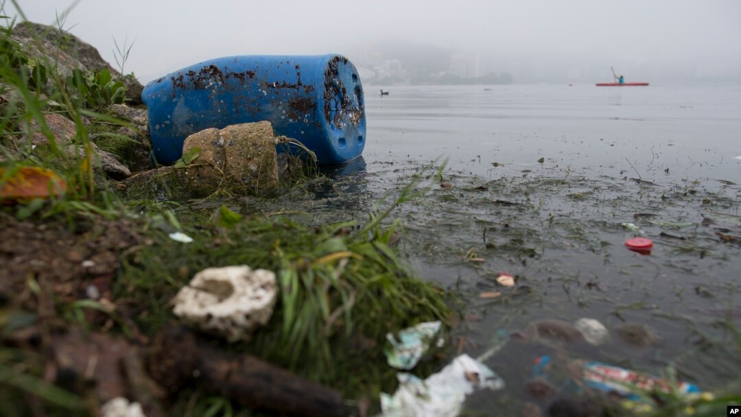 FILE - Trash litters Rodrigo de Freitas Lake in Rio de Janeiro, Brazil, Nov. 10, 2015. 