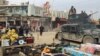 The scene directly outside the My Beautiful Lady restaurant three weeks before the bombing when the neighborhood was suddenly coming back to life in Mosul, Iraq, Jan. 21, 2017.