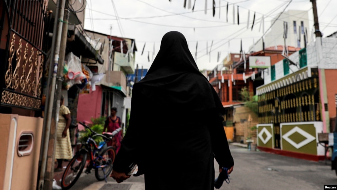 A Muslim woman wearing a hijab walks through a street near St. Anthony's Shrine, days after a string of suicide bomb attacks across the island on Easter Sunday, in Colombo, Sri Lanka, April 29, 2019.