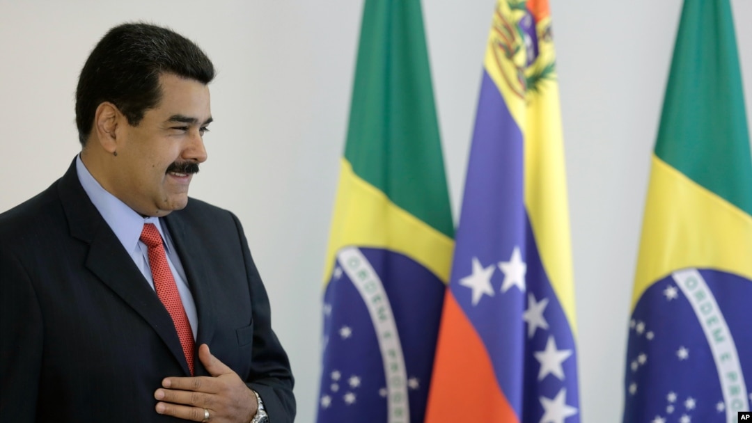 Venezuela's President Nicolas Maduro stands before reporters on the sidelines of a bilateral meeting with Brazil's President Dilma Rousseff in Brasilia, Jan. 2, 2015.