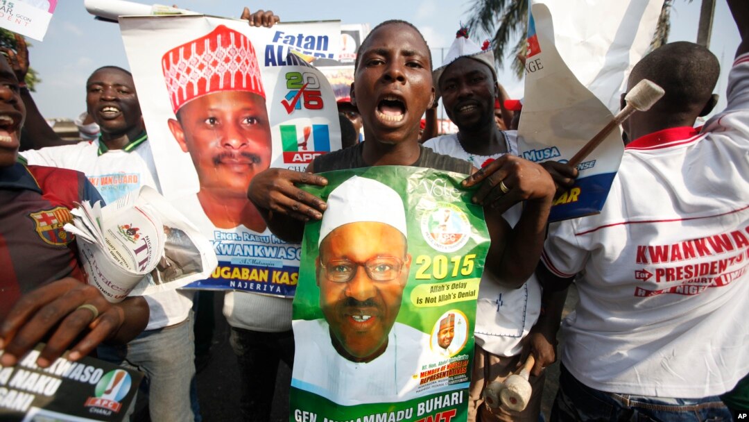 Supporters of former military leader, Muhammadu Buhari, and presidential aspirant, chant slogans during the All Progressive Congress party convention in Lagos, Nigeria,Wednesday, Dec. 10, 2014. 