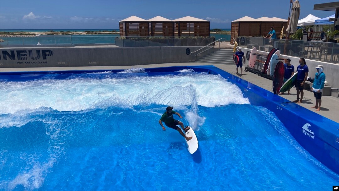Ikaika Kaulukukui surfs in a wave pool in Ewa Beach, Hawaii, on May 9, 2023. (AP Photo/Jennifer Sinco Kelleher)