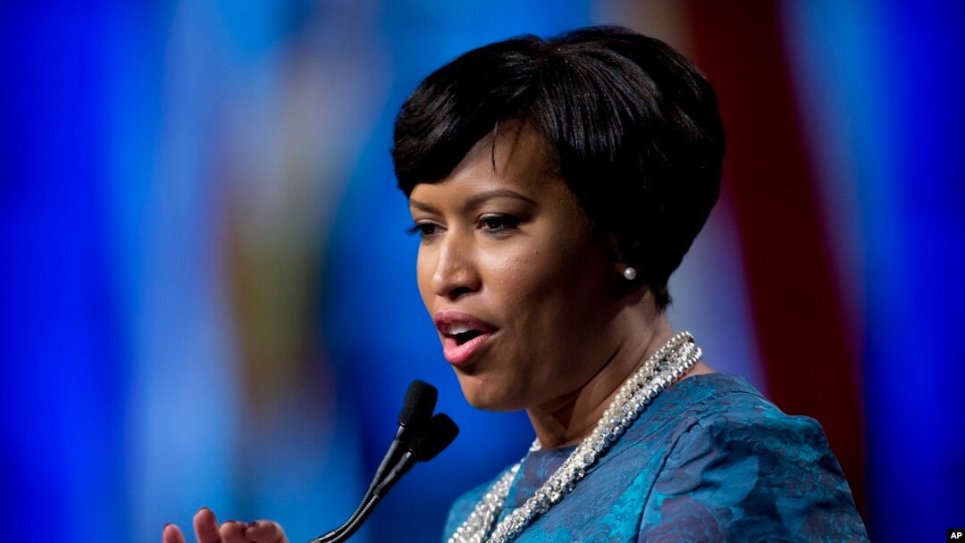 FILE - Washington Mayor Muriel Bowser, shown after taking the oath of office last month, defied a lawmaker's threat that she and other city leaders could face prison time for implementing a voter-approvedmarijuana law. 