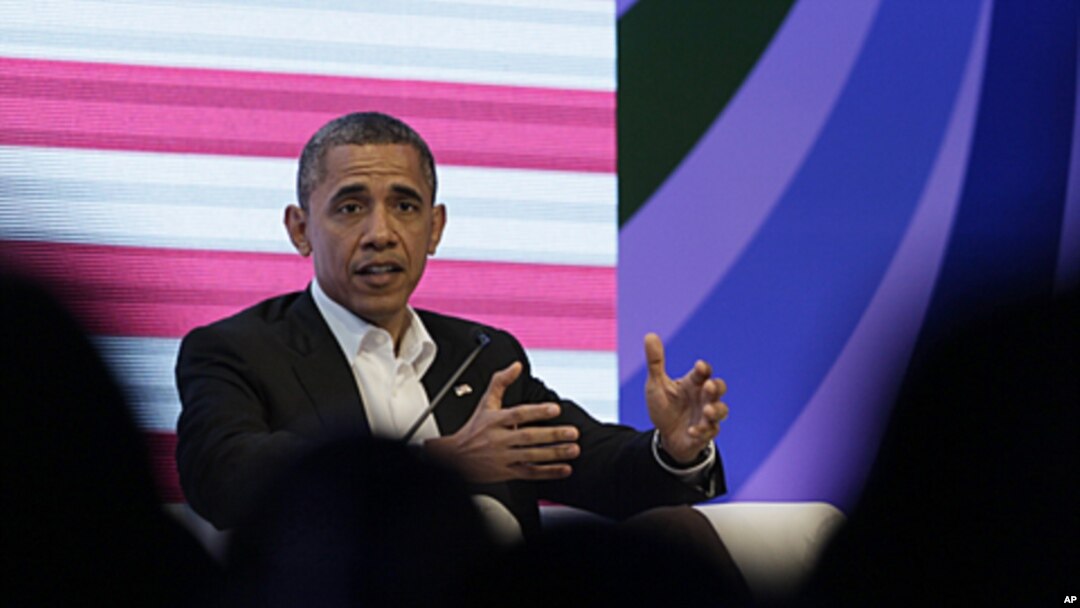 President Barack Obama participates in a three-way conversation with Brazil's President Dilma Rousseff and Colombia's President Juan Manuel Santos, not pictured, at the CEO Summit of the Americas, in Cartagena, Colombia, April 14, 2012.