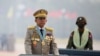 FILE - Myanmar's junta chief Senior General Min Aung Hlaing presides over an army parade on Armed Forces Day in Naypyitaw, Myanmar, March 27, 2021. 