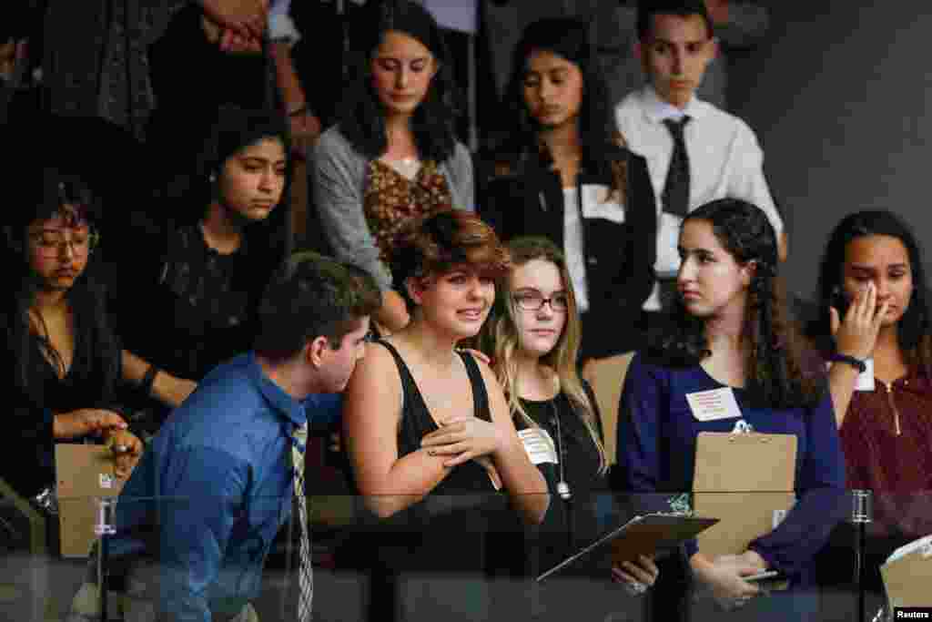 Students from Marjory Stoneman Douglas High School and those supporting them react as they watch the Florida House of Representatives vote down a procedural move to take a bill banning assault weapons out of committee and bring it to the floor for a vote in Tallahassee, Florida, following last week's mass shooting on their campus, Feb. 20, 2018.