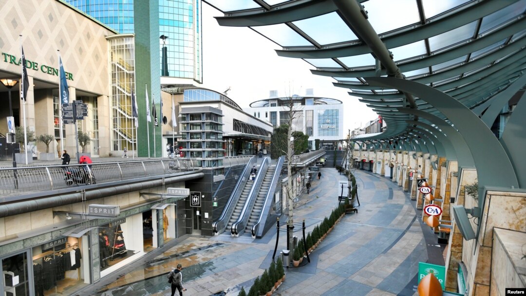 People walk an empty shopping street as Netherlands is set to extend the lockdown as the spread of the coronavirus continues in Rotterdam, Netherlands, Jan. 12 2021.