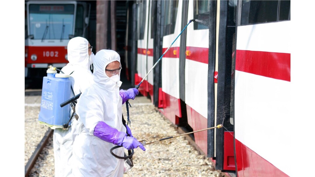 Members from an emergency anti-epidemic headquarters in Mangyongdae District, disinfect a tramcar of Songsan Tram Station in Pyongyang, North Korea, Feb. 26, 2020. Uncertainly remained over how best to stem the spread of the illness.