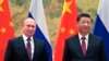 Chinese President Xi Jinping, right, and Russian President Vladimir Putin pose for a photo prior to their talks in Beijing, China, Feb. 4, 2022.