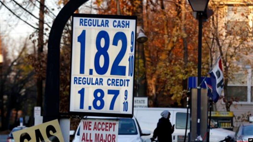 Gas prices are displayed at a service station in Leonia, N.J., Tuesday, Nov. 24, 2015. With Thanksgiving gas prices falling, the number of travelers is expected to rise, with one traffic-tracking firm predicting delays could be noticeably longer than last year. (AP Photo/Seth Wenig)