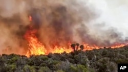 In this image made from video, fires burn on Mount Kilimanjaro in Tanzania on Oct. 12, 2020.