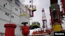 FILE - A section of an oil platform operated by Lukoil company is seen at the Kravtsovskoye oil field in the Baltic Sea, Russia, Sept. 16, 2021.