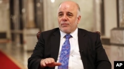 FILE - Iraqi Prime Minister Haider al-Abadi is seen speaking to the media.