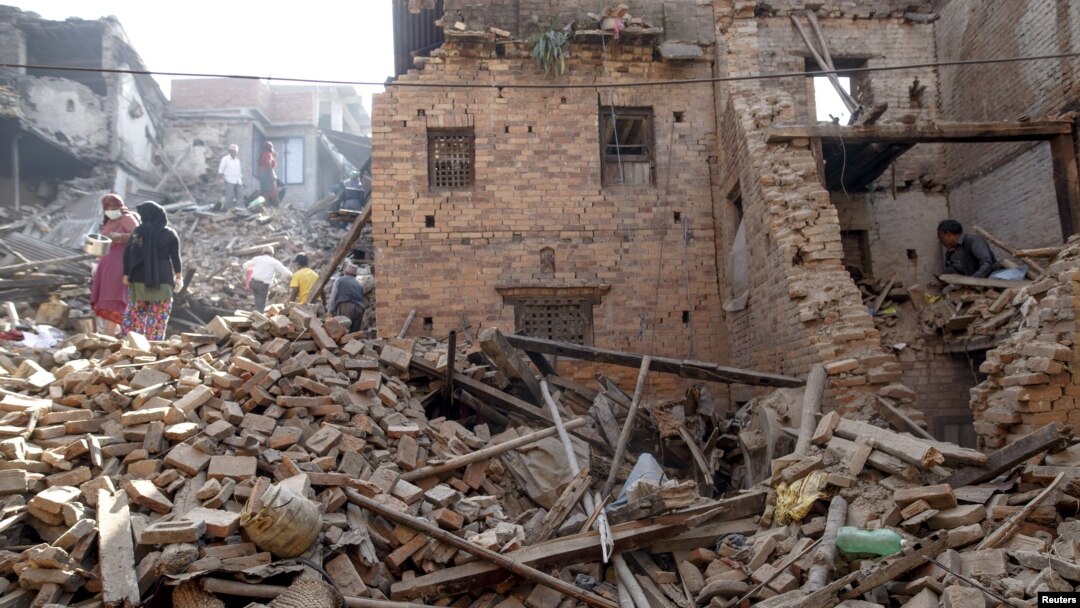 Local residents clear the rubble from their homes which were destroyed after last week's earthquake in Bhaktapur, Nepal, May 4, 2015.