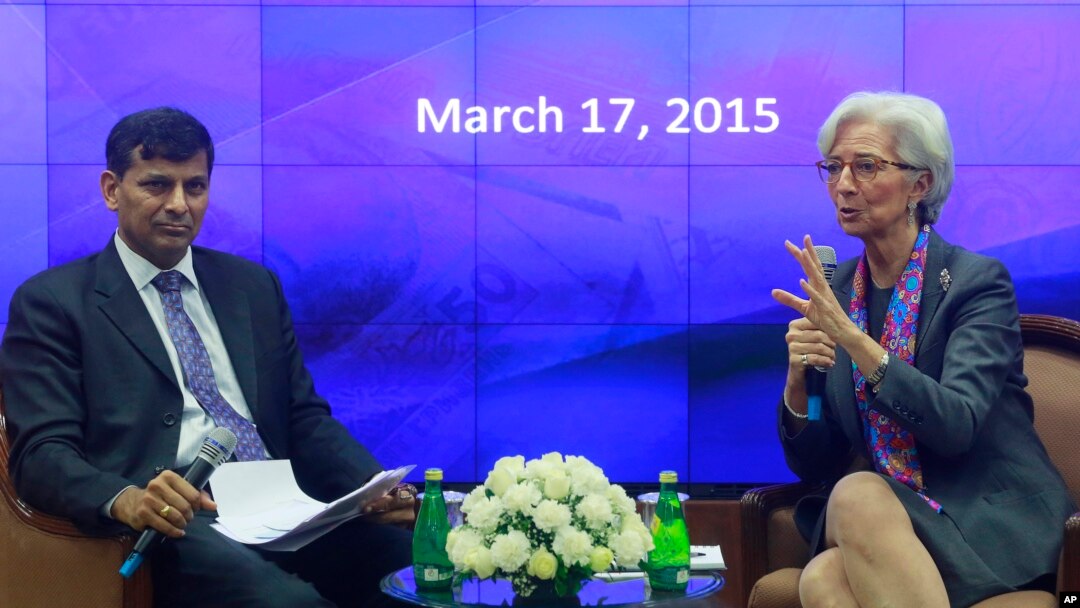 Managing Director of the International Monetary Fund Christine Lagarde, right, speaks as Governor of Reserve Bank of India (RBI) Raghuram Rajan looks on during an event at the RBI headquarters in Mumbai, India, March 17, 2015. 