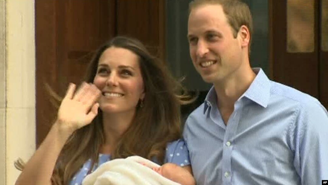 In this image from video, The Duke and Duchess of Cambridge leave the Lindo Wing of St Mary's Hospital in London, July 23 2013, carrying their new-born son, the Prince of Cambridge who was born Monday, into public view for the first time.