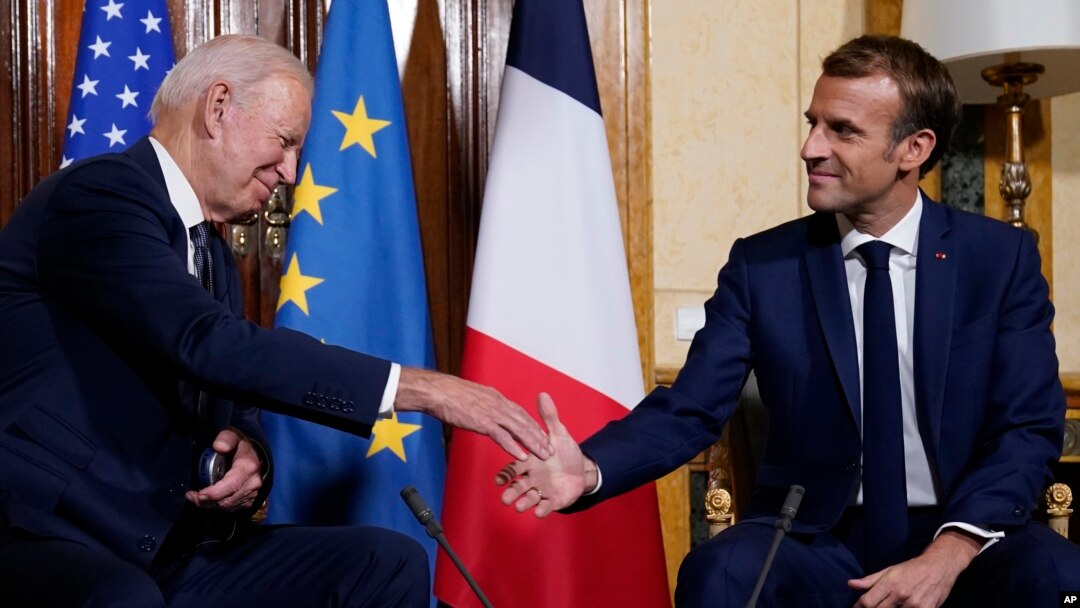 U.S. President Joe Biden, left, shakes hands with French President Emmanuel Macron during a meeting at La Villa Bonaparte in Rome, Italy, Oct. 29, 2021.
