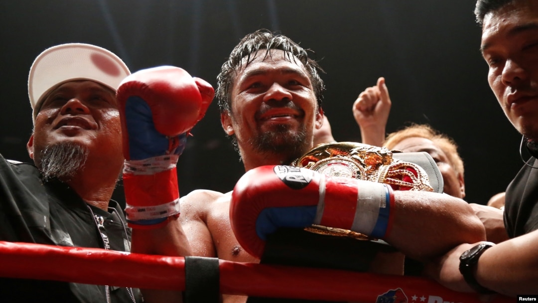  Manny Pacquiao celebrates after winning the WBA welterweight title fight against Argentinian Lucas Matthysse, July 15, 2018, in Kuala Lumpur, Malaysia.