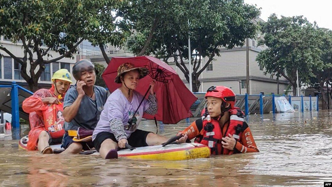 Rescue personnel evacuate residents from a flooded area following heavy rains caused by Typhoon Haikui in Xiamen, in China's southern Fujian province on Sept. 6, 2023. 