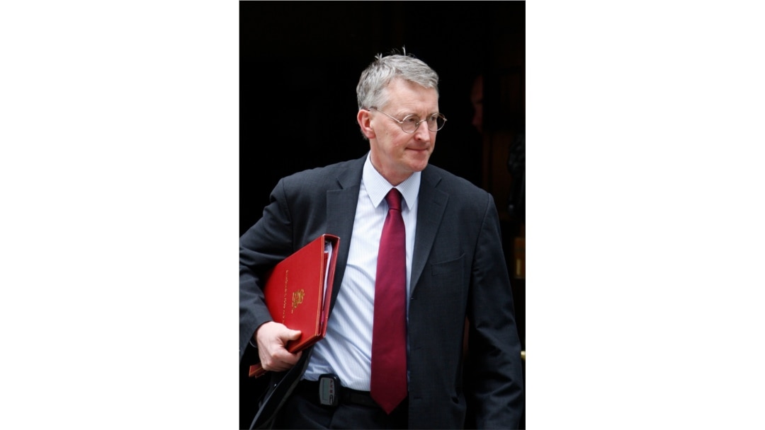 Hilary Benn leaves 10 Downing Street in London after a meeting, June 12, 2009.