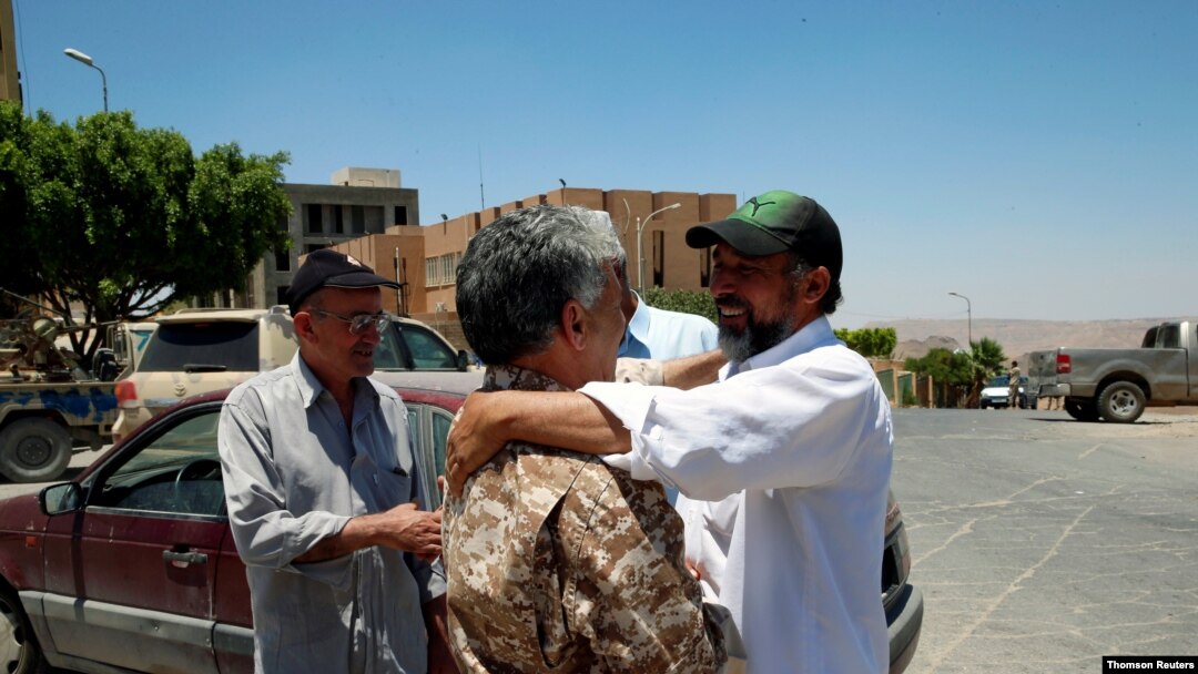 People celebrate the liberation of their city from the eastern forces led by Khalifa Haftar, in Gharyan.