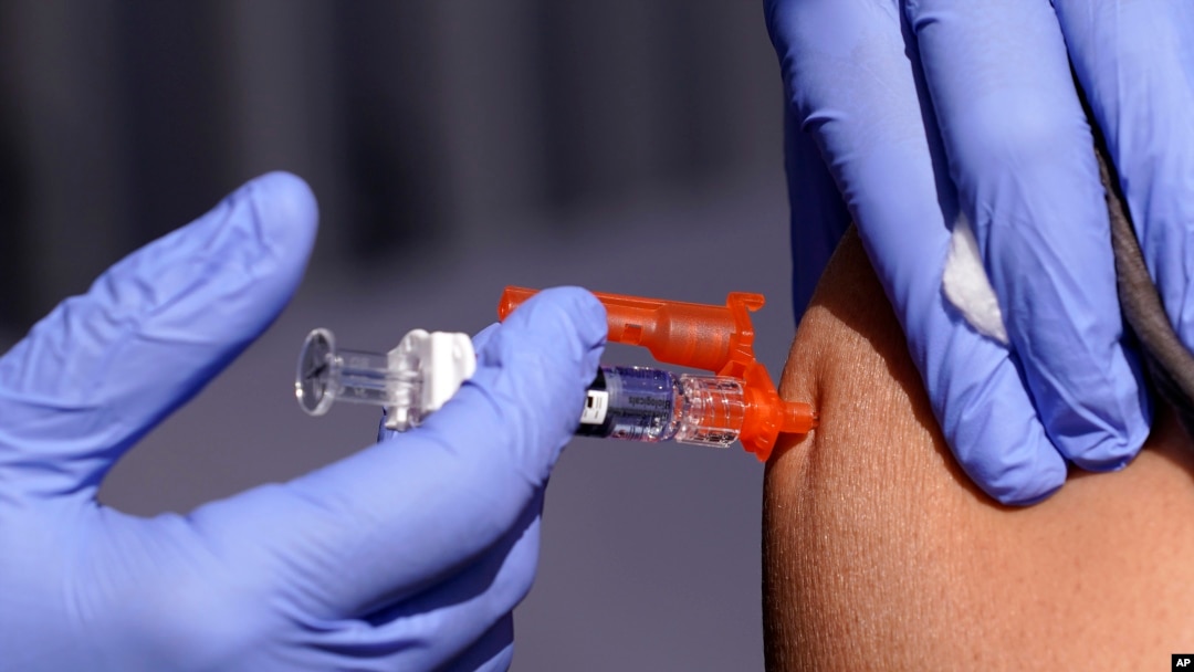 FILE - A patient is given a flu vaccine in Lynwood, Calif., Oct. 28, 2022. The Centers for Disease Control and Prevention estimates 19,000 people have died from the flu so far this winter, including 86 children. 