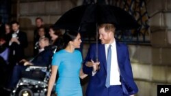 FILE - Britain's Prince Harry and Meghan arrive at the annual Endeavour Fund Awards in London, March 5, 2020.